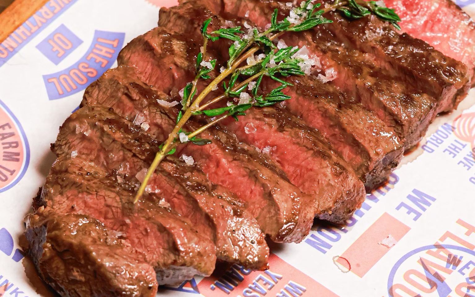 Flame-grilled Flat Iron steak with fries at BrewDog Bangkok